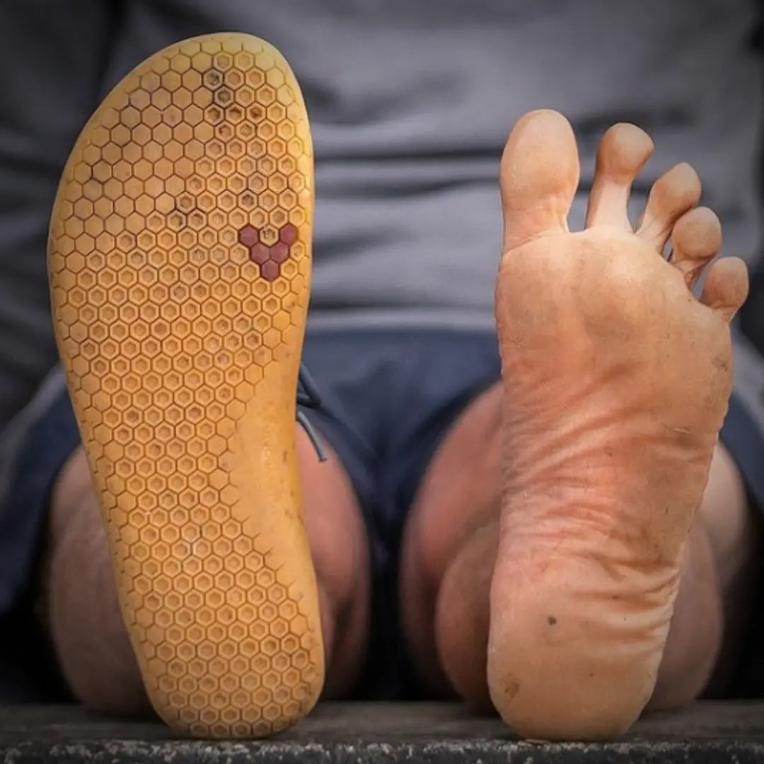 Vivobarefoot shoes are natural shoes. A wide toe box allows your feet to splay naturally, a thin sole means you can feel the ground, a flat and flexible shoe means your feet can work and strength.