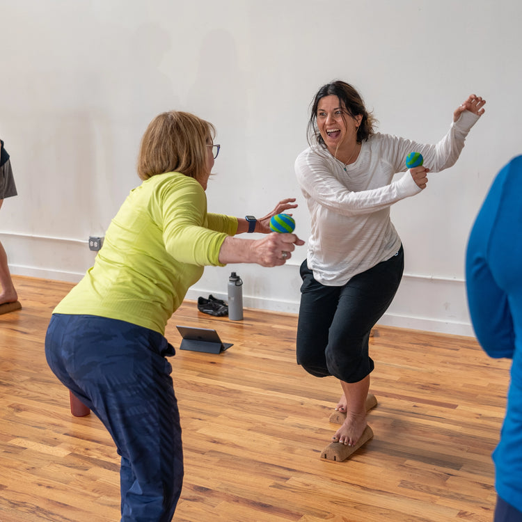 Women performing foot training exercises using SoleMate tools to improve foot strength and mobility