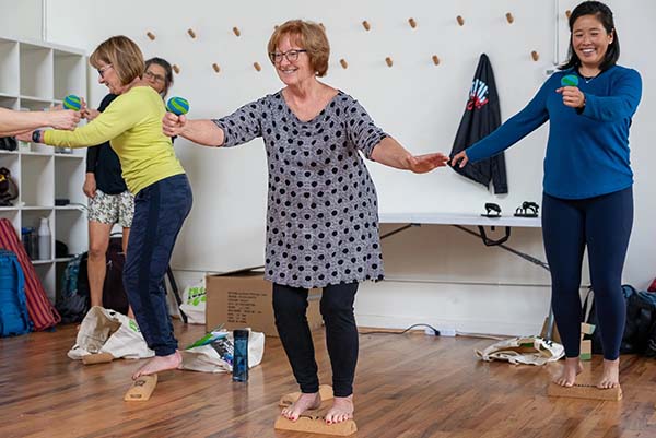 Elder woman having fun while training with the SoleMate Kit